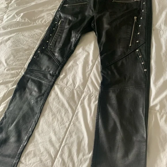 Diesel Leather Pants Mens with front and back pockets with zippers on them.